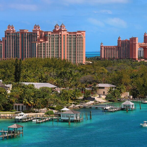 Atlantis resort towers rising above turquoise harbour and wooden docks on Paradise Island