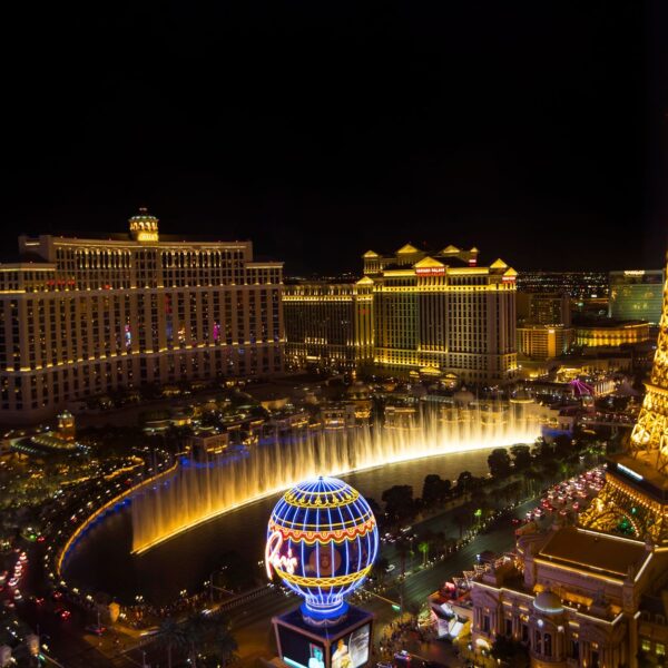 Las Vegas Strip at night with Bellagio fountains, Caesars Palace and Eiffel Tower replica