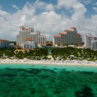 Baha Mar resort towers rising above a beach and turquoise water on Cable Beach