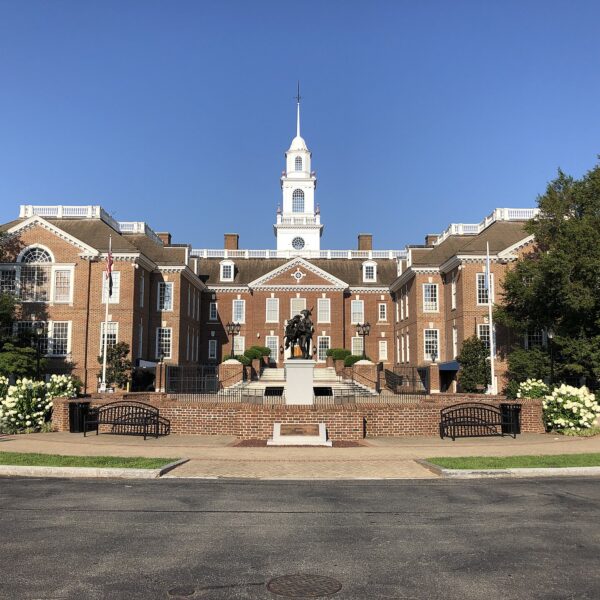 Delaware Legislative Hall in Dover, a red-brick building with white clock tower, under clear sky