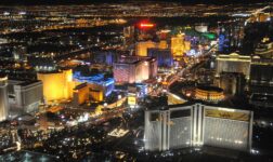 Aerial night view of the Las Vegas Strip with brightly lit casino resort towers