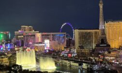 Las Vegas Strip at night with Bellagio fountains, Eiffel Tower replica and High Roller wheel