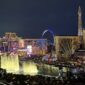 Las Vegas Strip at night with Bellagio fountains, Eiffel Tower replica and High Roller wheel