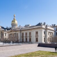New Jersey State House in Trenton with its golden dome under a clear blue sky