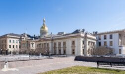 New Jersey State House in Trenton with its golden dome under a clear blue sky