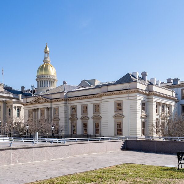 New Jersey State House in Trenton with its golden dome under a clear blue sky