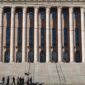 Granite columns and wide front steps of Finland's Parliament House in Helsinki