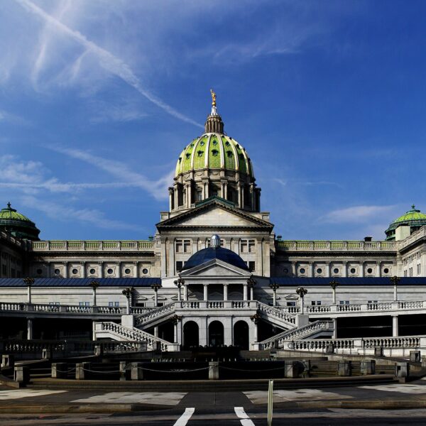 Pennsylvania State Capitol in Harrisburg with green dome under a blue sky