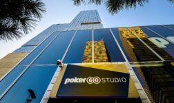 PokerGO Studio sign above the entrance of a glass tower in Las Vegas